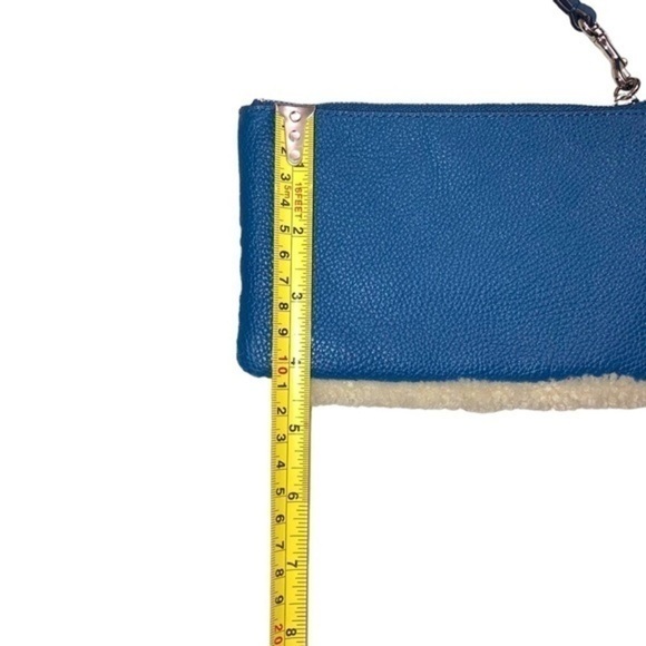 Coach blue pebbled leather and shearling wristlet bag